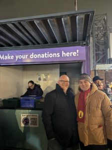 Gregg Hunt and Ian Byrne MP standing outside the Fans Supporting Foodbanks collection point in Liverpool, November 2024