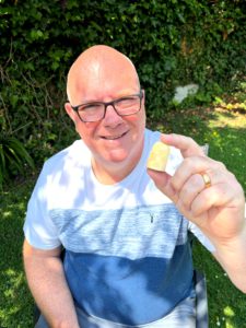 Gregory Hunt holding a carved Lewis-style chess pawn, symbolising ADR administrators and the potential for career growth within the field.